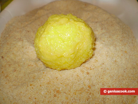 Roll the balls around in baking bread