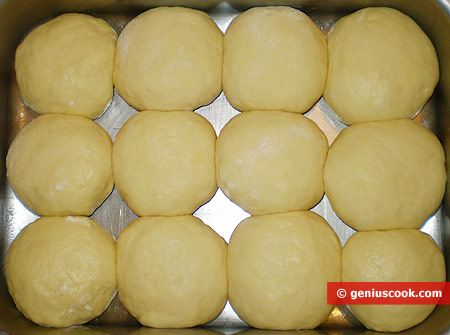 Place the buns seam down onto a deep baking tray