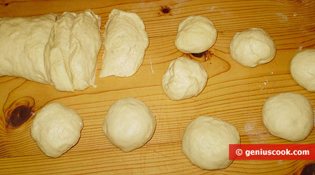 Dough cut up into medium-sized pieces. Roll each piece into a ball