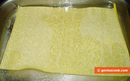 Boil pasta sheets for lasagna one by one