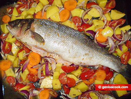 Fish on a baking tray with vegetables