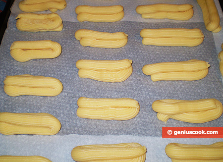 dough into an oblong shapes on a baking paper lined baking sheet