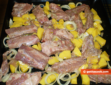 Pork Ribs with Potatoes on a baking tray