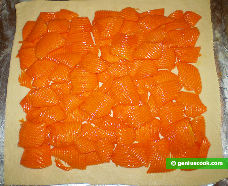pumpkin slices on top of the rolled-out dough